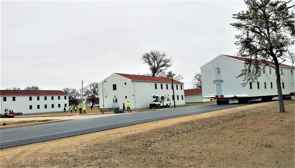 Continuing making history: Contractors move last two World War II-era barracks to new locations