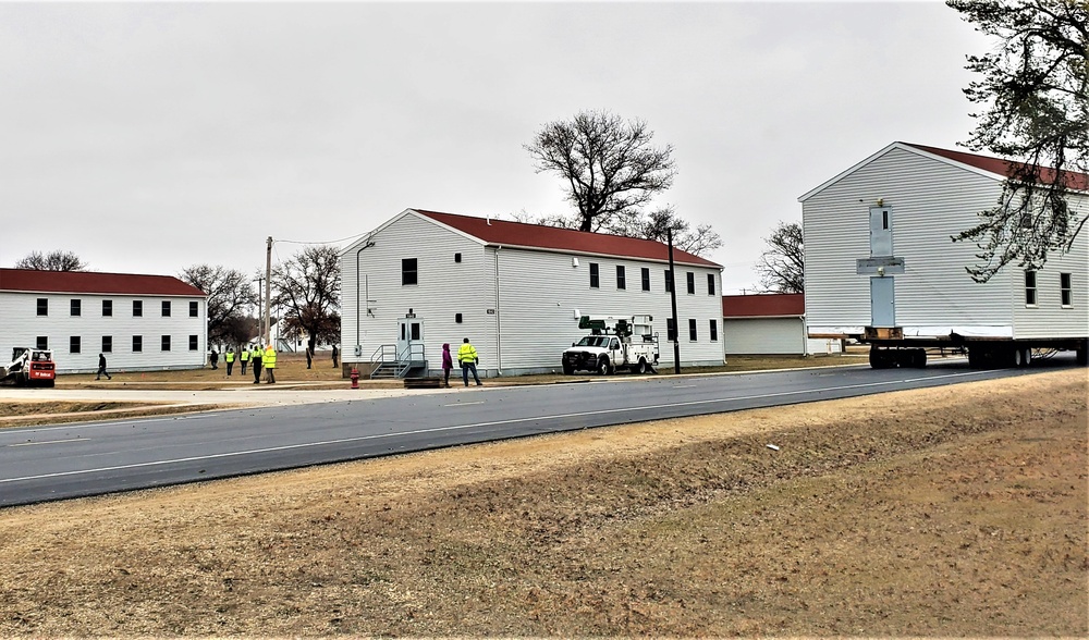 Continuing making history: Contractors move last two World War II-era barracks to new locations