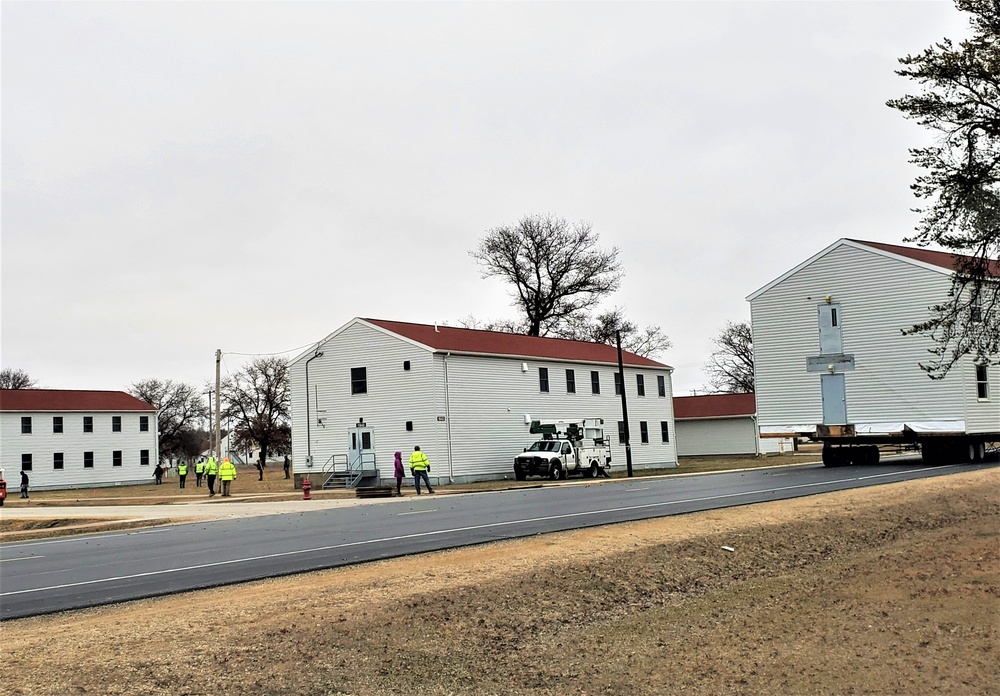 Continuing making history: Contractors move last two World War II-era barracks to new locations