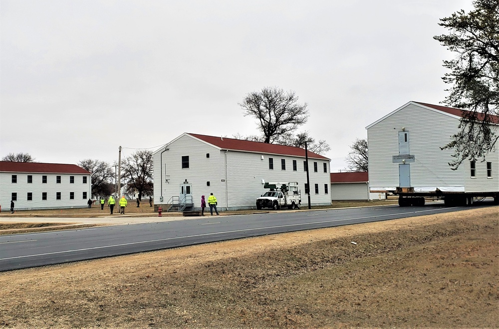 Continuing making history: Contractors move last two World War II-era barracks to new locations