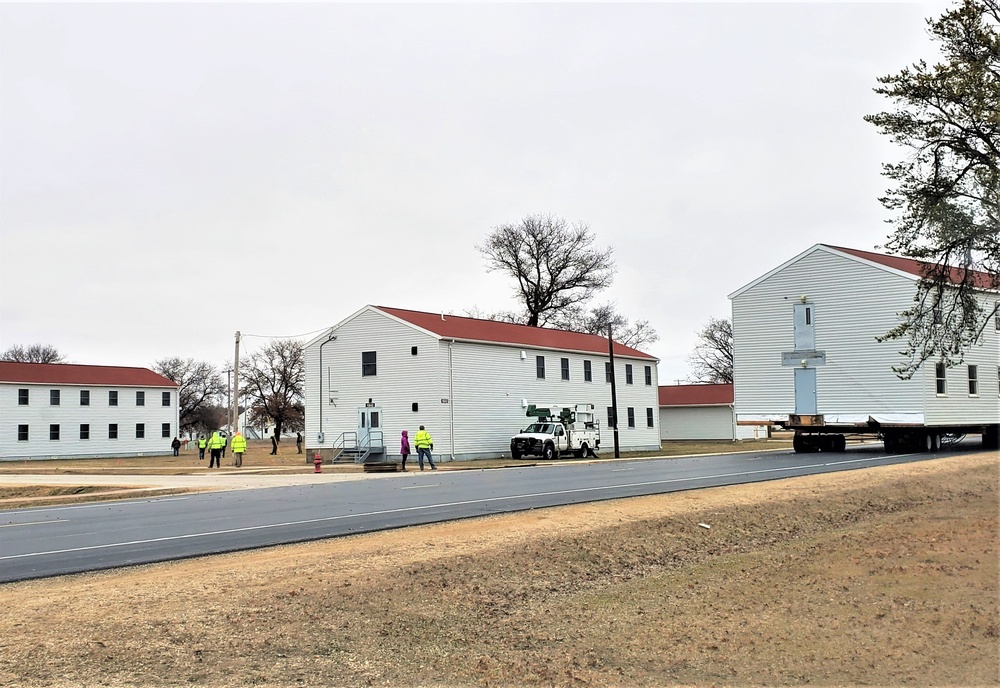 Continuing making history: Contractors move last two World War II-era barracks to new locations