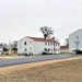 Continuing making history: Contractors move last two World War II-era barracks to new locations