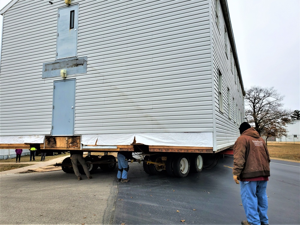 Continuing making history: Contractors move last two World War II-era barracks to new locations