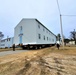 Continuing making history: Contractors move last two World War II-era barracks to new locations