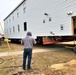 Continuing making history: Contractors move last two World War II-era barracks to new locations