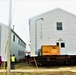 Continuing making history: Contractors move last two World War II-era barracks to new locations