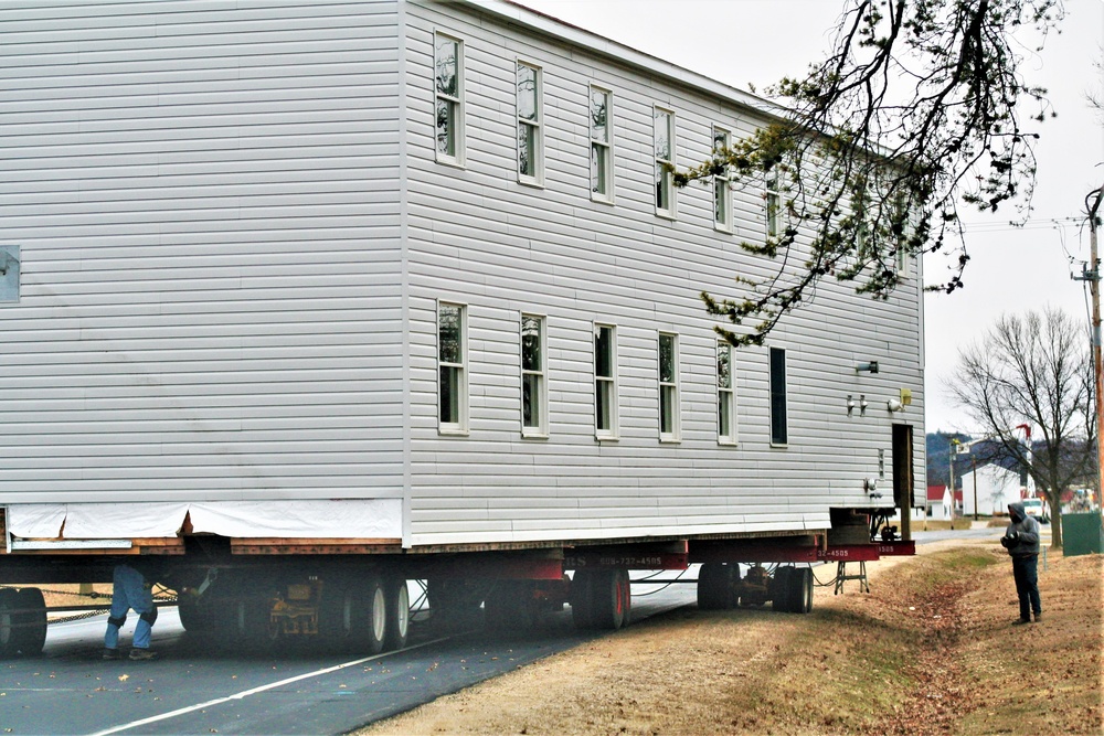 Continuing making history: Contractors move last two World War II-era barracks to new locations