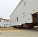 Continuing making history: Contractors move last two World War II-era barracks to new locations