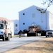 Continuing making history: Contractors move last two World War II-era barracks to new locations