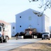 Continuing making history: Contractors move last two World War II-era barracks to new locations