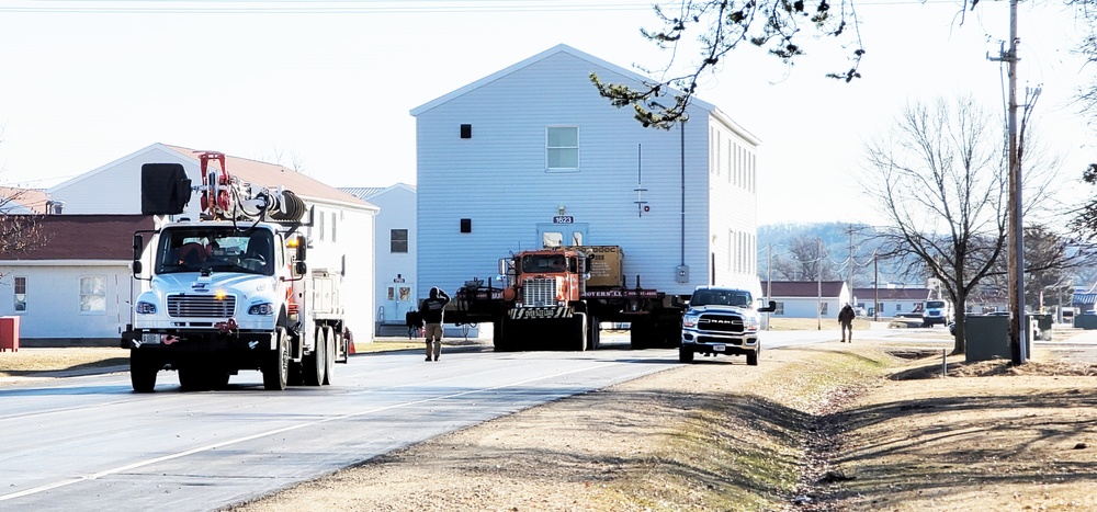 Continuing making history: Contractors move last two World War II-era barracks to new locations