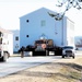 Continuing making history: Contractors move last two World War II-era barracks to new locations