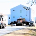 Continuing making history: Contractors move last two World War II-era barracks to new locations