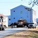 Continuing making history: Contractors move last two World War II-era barracks to new locations