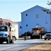 Continuing making history: Contractors move last two World War II-era barracks to new locations