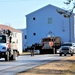 Continuing making history: Contractors move last two World War II-era barracks to new locations