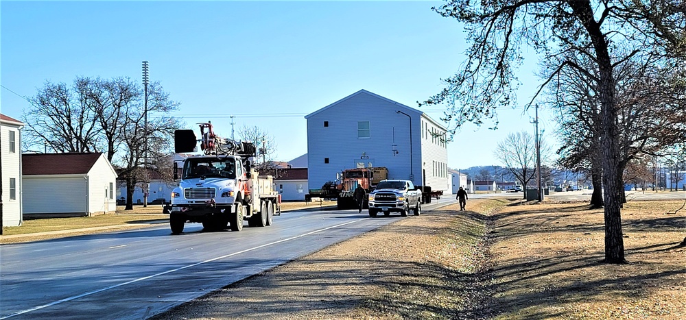 Continuing making history: Contractors move last two World War II-era barracks to new locations