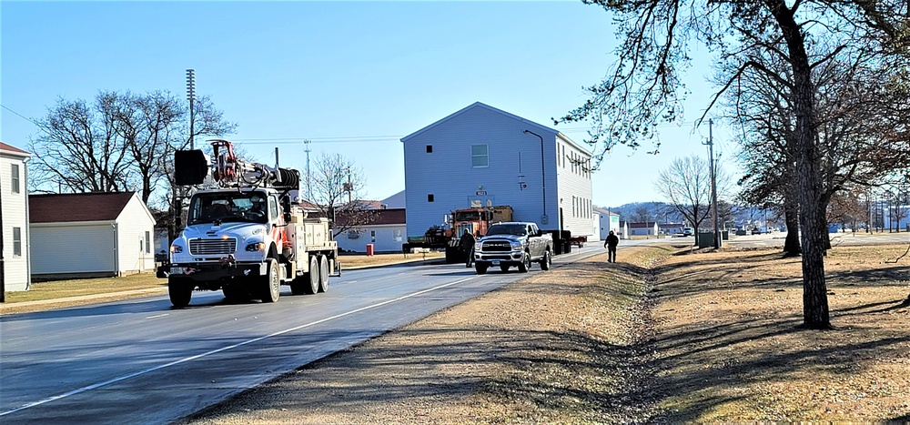 Continuing making history: Contractors move last two World War II-era barracks to new locations