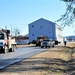 Continuing making history: Contractors move last two World War II-era barracks to new locations