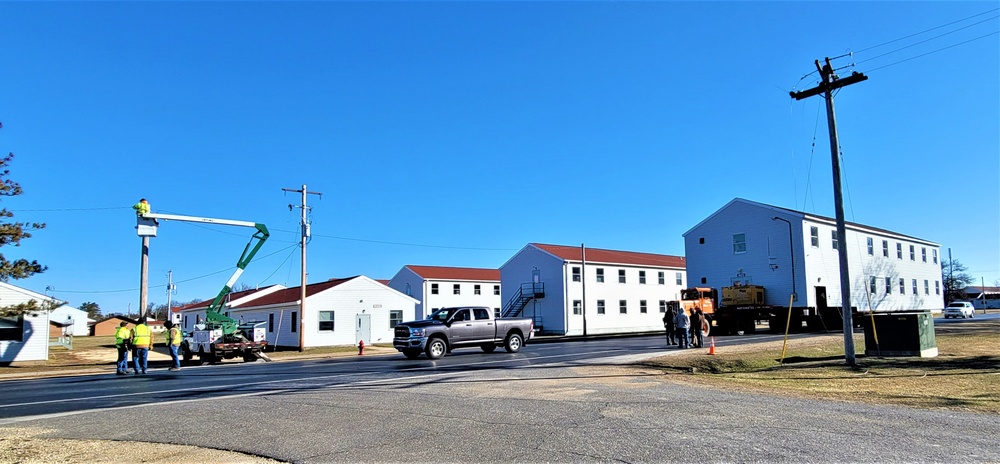 Continuing making history: Contractors move last two World War II-era barracks to new locations