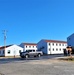 Continuing making history: Contractors move last two World War II-era barracks to new locations