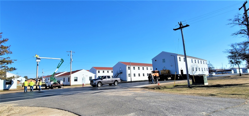 Continuing making history: Contractors move last two World War II-era barracks to new locations