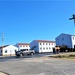 Continuing making history: Contractors move last two World War II-era barracks to new locations