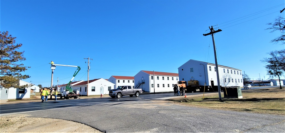 Continuing making history: Contractors move last two World War II-era barracks to new locations