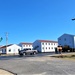 Continuing making history: Contractors move last two World War II-era barracks to new locations