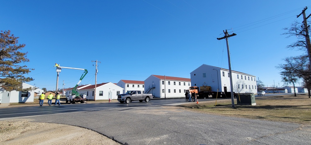 Continuing making history: Contractors move last two World War II-era barracks to new locations