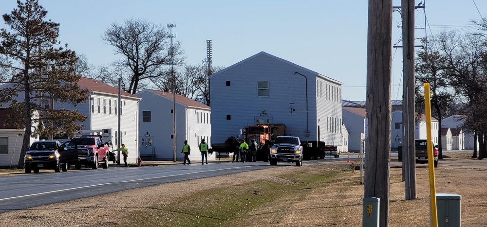 Continuing making history: Contractors move last two World War II-era barracks to new locations