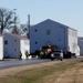 Continuing making history: Contractors move last two World War II-era barracks to new locations