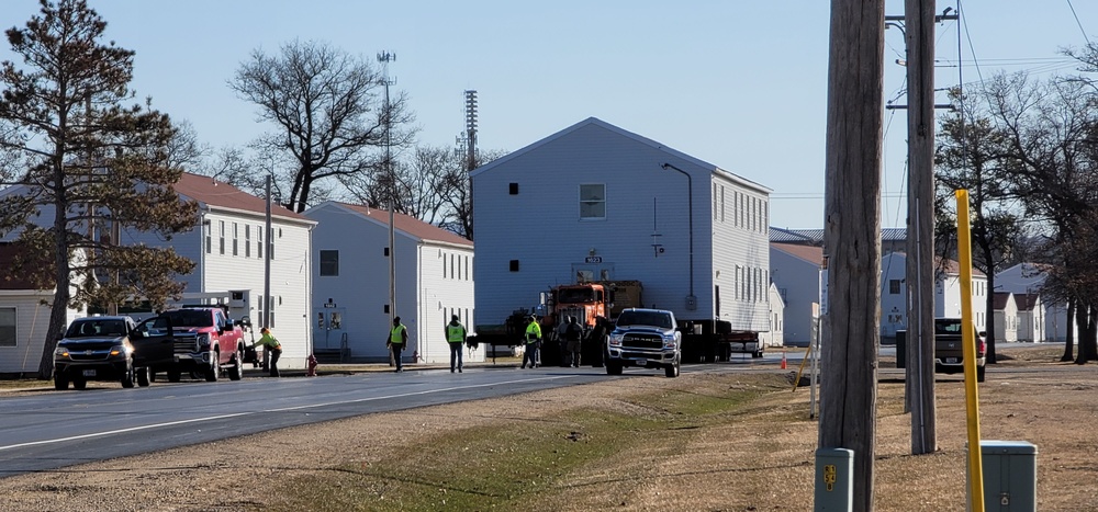 Continuing making history: Contractors move last two World War II-era barracks to new locations