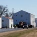 Continuing making history: Contractors move last two World War II-era barracks to new locations