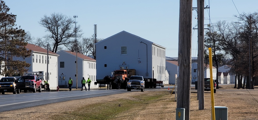 Continuing making history: Contractors move last two World War II-era barracks to new locations