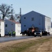 Continuing making history: Contractors move last two World War II-era barracks to new locations