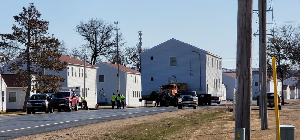 Continuing making history: Contractors move last two World War II-era barracks to new locations