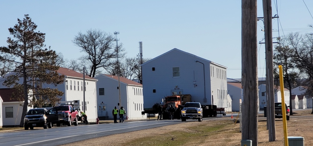 Continuing making history: Contractors move last two World War II-era barracks to new locations