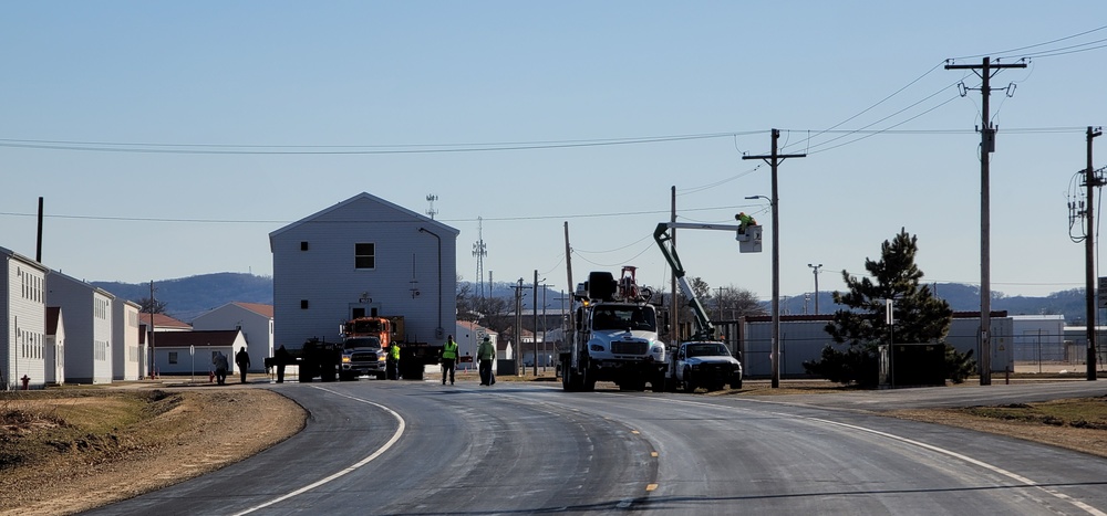 Continuing making history: Contractors move last two World War II-era barracks to new locations