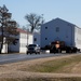 Continuing making history: Contractors move last two World War II-era barracks to new locations