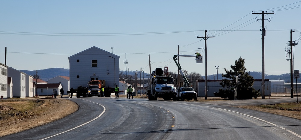 Continuing making history: Contractors move last two World War II-era barracks to new locations