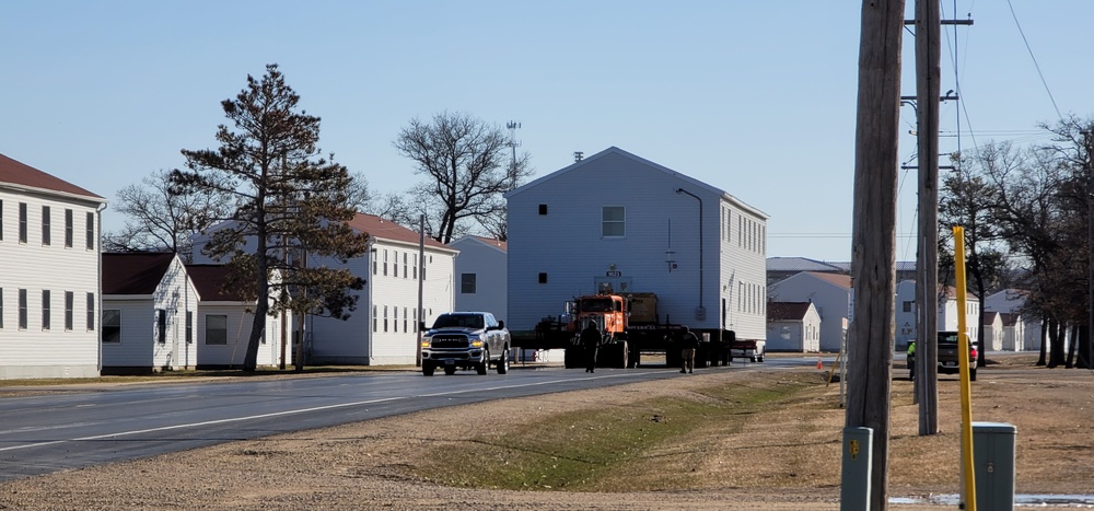 Continuing making history: Contractors move last two World War II-era barracks to new locations