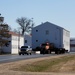 Continuing making history: Contractors move last two World War II-era barracks to new locations