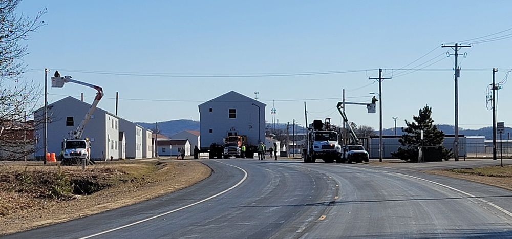 Continuing making history: Contractors move last two World War II-era barracks to new locations