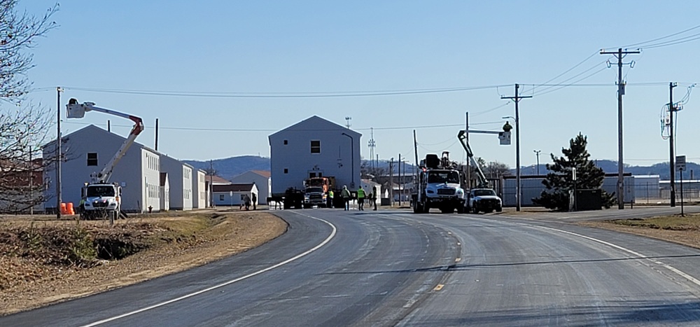 Continuing making history: Contractors move last two World War II-era barracks to new locations