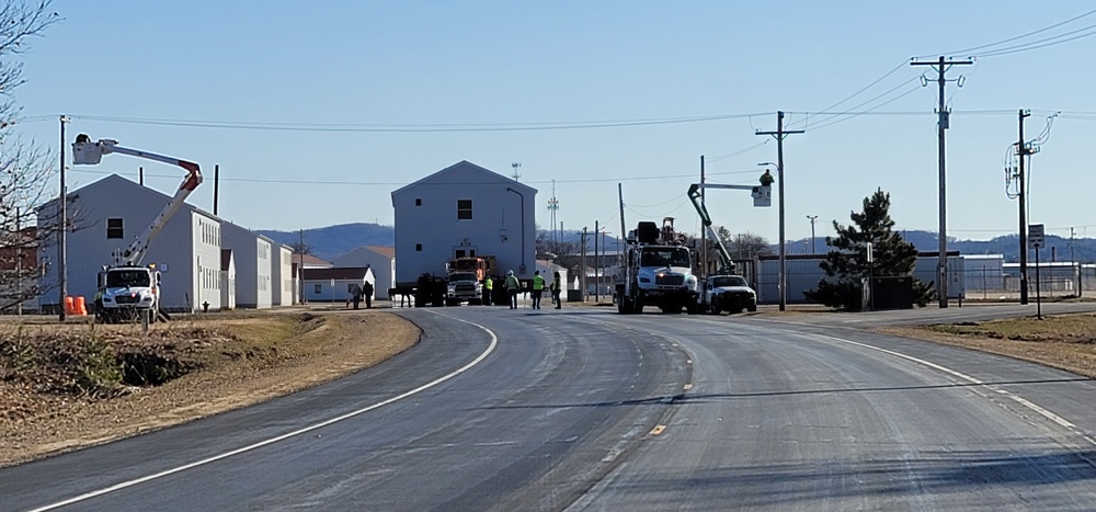 Continuing making history: Contractors move last two World War II-era barracks to new locations