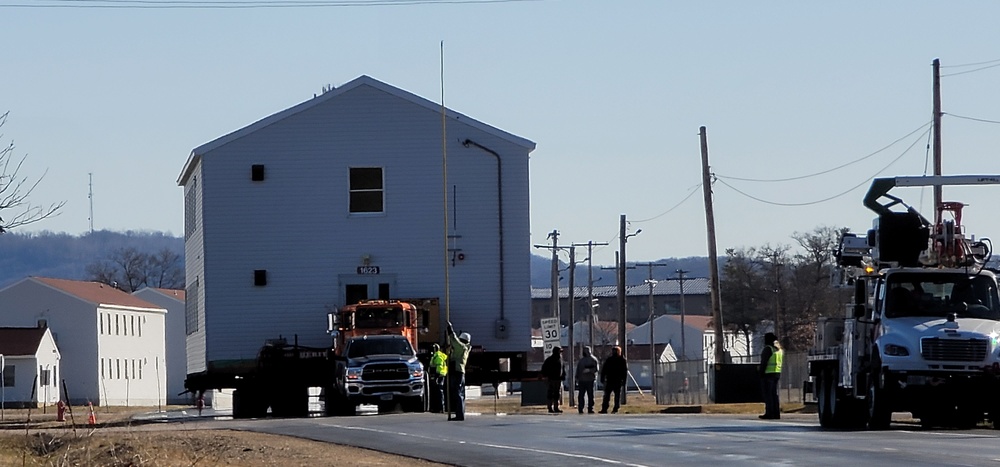 Continuing making history: Contractors move last two World War II-era barracks to new locations