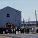 Continuing making history: Contractors move last two World War II-era barracks to new locations