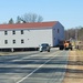 Continuing making history: Contractors move last two World War II-era barracks to new locations