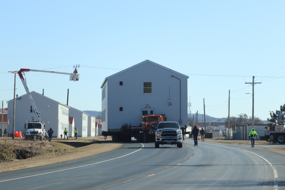 Continuing making history: Contractors move last two World War II-era barracks to new locations